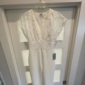 ELEGANT JUMPSUIT in White lace and sequin details . HARLYN BRAND from Nordstroms